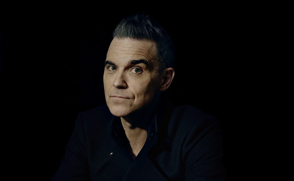 Иллюстрация — Park Live Almaty расширяется: к лайн-апу присоединяется Robbie Williams. Певец станет хедлайнером дополнительного дня фестиваля